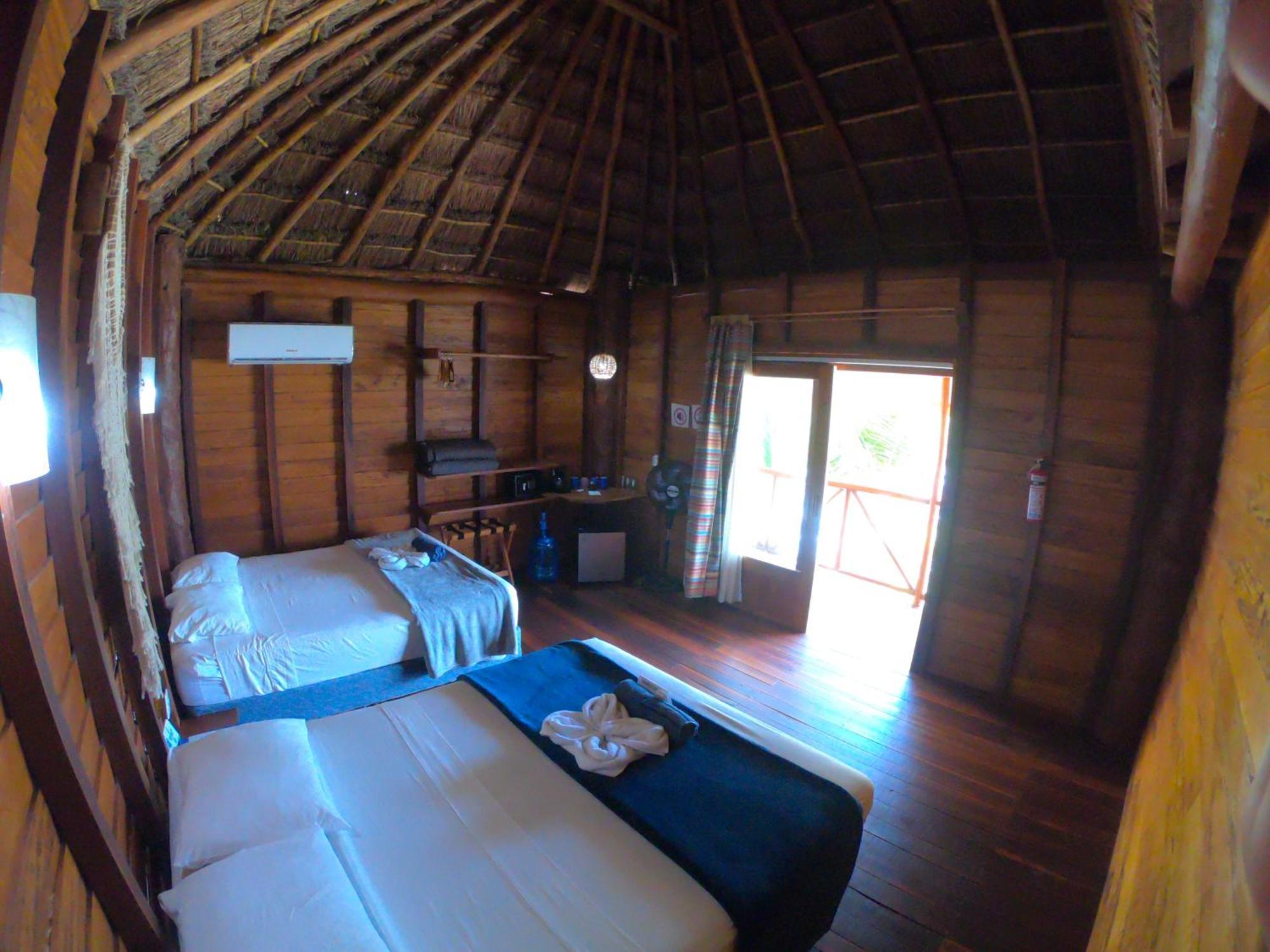Palmeras De Mahahual Cabanas Стая снимка